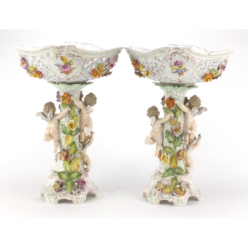 735 - Large pair of Dresden floral encrusted porcelain centrepieces with pierced baskets on naturalistic s... 