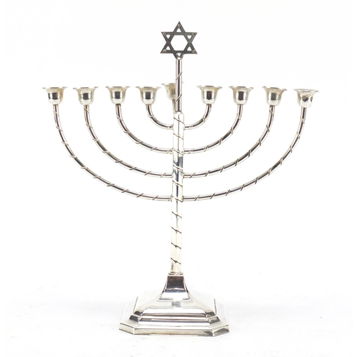 141 - Silver plated Jewish Menorah candlestick, 22.5cm high