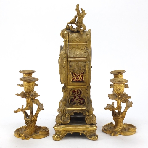 34 - 19th century French Ormolu acanthus design mantle clock with two branch candlestick garnitures, the ... 