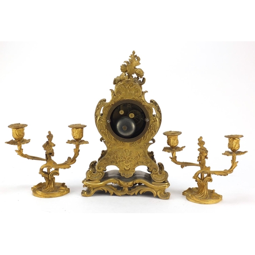 34 - 19th century French Ormolu acanthus design mantle clock with two branch candlestick garnitures, the ... 