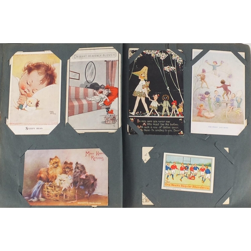 499 - Edwardian and later postcards arranged in an album including Margaret Tarrant, Mabel Lucy Attwell, L... 