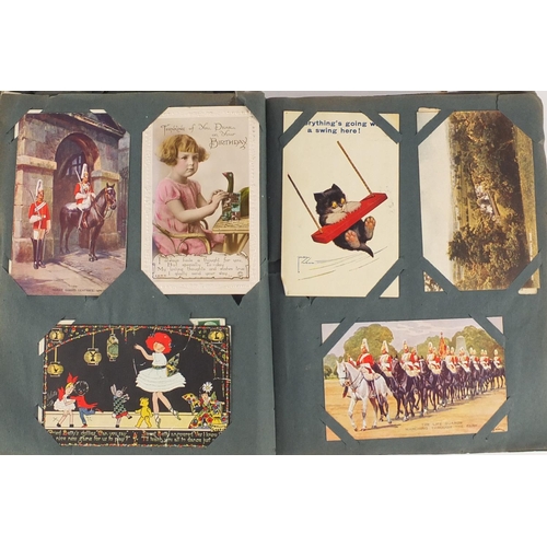 499 - Edwardian and later postcards arranged in an album including Margaret Tarrant, Mabel Lucy Attwell, L... 