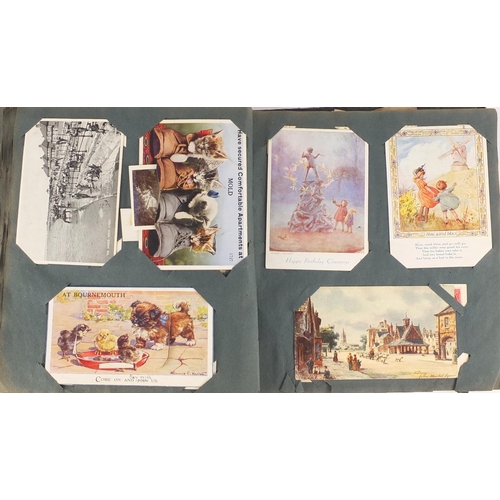 499 - Edwardian and later postcards arranged in an album including Margaret Tarrant, Mabel Lucy Attwell, L... 