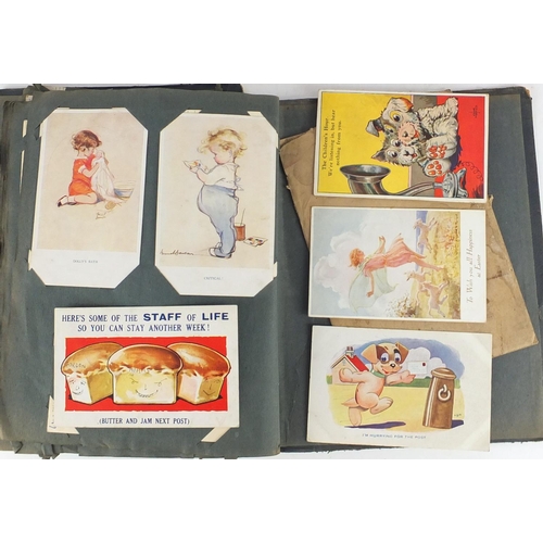 499 - Edwardian and later postcards arranged in an album including Margaret Tarrant, Mabel Lucy Attwell, L... 