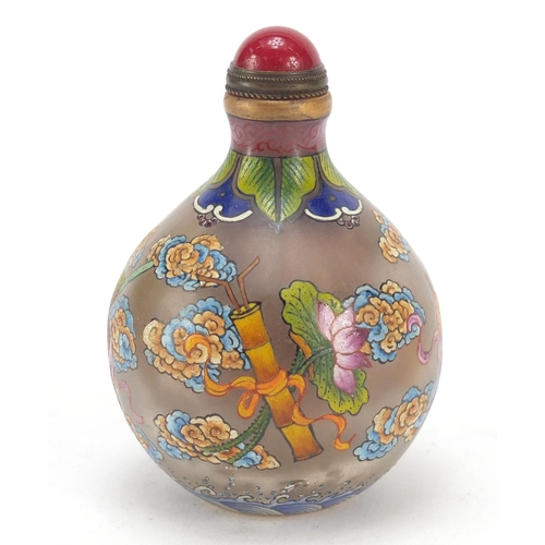 585 - Chinese glass snuff bottle hand painted with Daoist emblems, character marks to the base, 8cm high