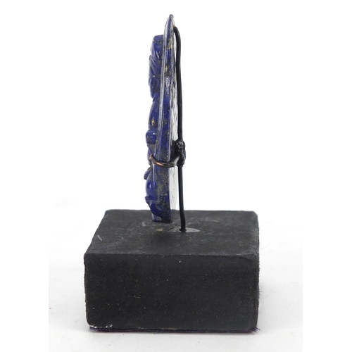 1613 - Chinese lapis lazuli pendant carved with a seated Buddha on stand, the carving 5.2cm high