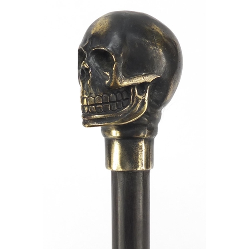 2014 - Hardwood walking stick with bronzed skull design pommel, 90cm in length