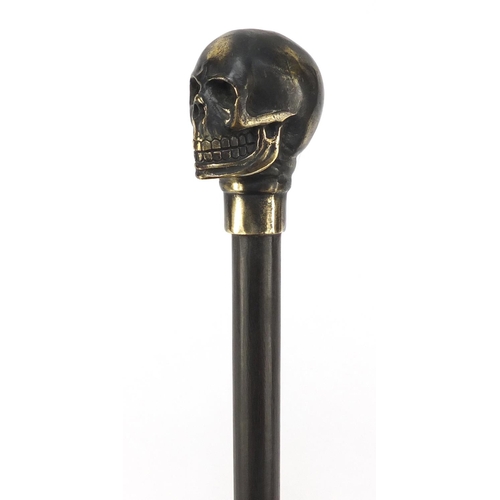 2014 - Hardwood walking stick with bronzed skull design pommel, 90cm in length