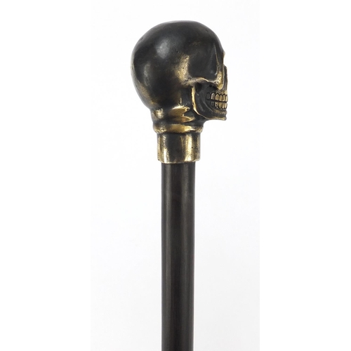 2014 - Hardwood walking stick with bronzed skull design pommel, 90cm in length