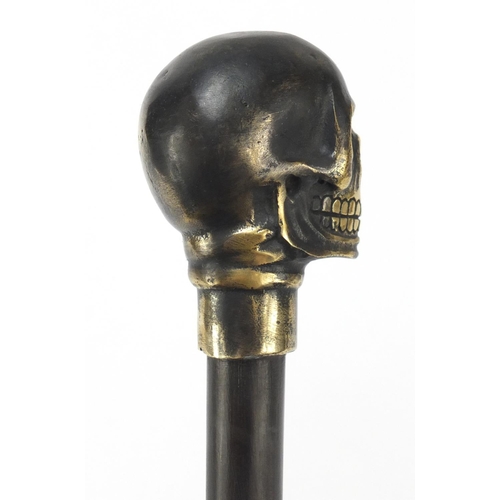 2014 - Hardwood walking stick with bronzed skull design pommel, 90cm in length