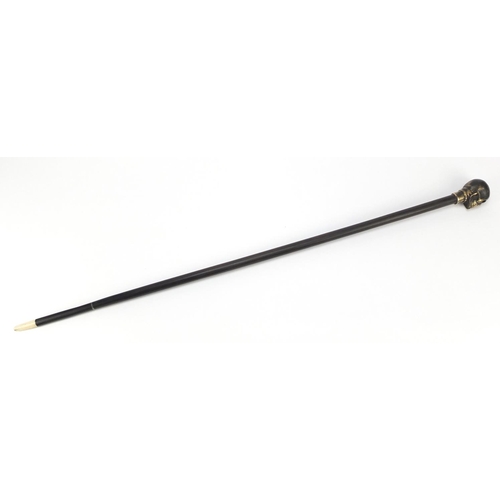 2014 - Hardwood walking stick with bronzed skull design pommel, 90cm in length