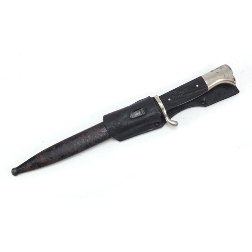 692 - German military World War II Puma bayonet with scabbard and leather frog, 35cm in length