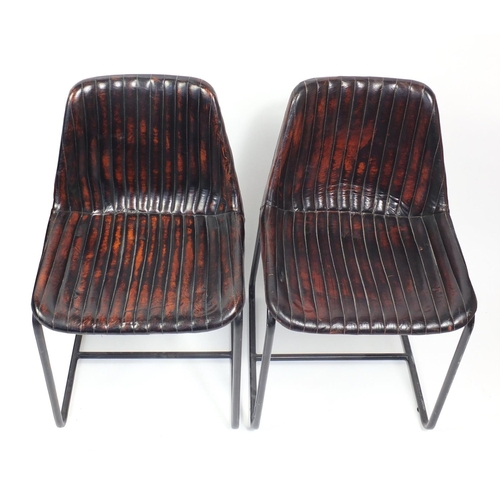 1395 - Pair of industrial chairs with brown upholstery, each 79cm high