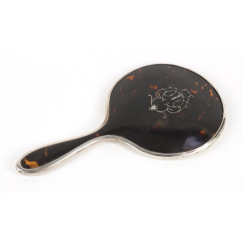 310 - George V silver and tortoiseshell pique work hand mirror with bevelled glass, London 1926, 24.5cm in... 