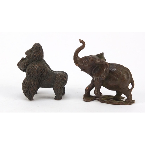 578 - Two Japanese patinated bronze animals of a gorilla and elephant, the largest 5cm high