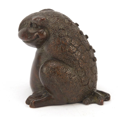 718 - Japanese patinated bronze seated armadillo, impressed marks to the base, 5cm high