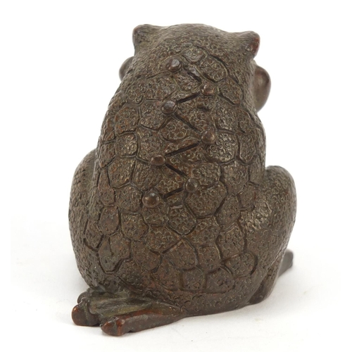 718 - Japanese patinated bronze seated armadillo, impressed marks to the base, 5cm high