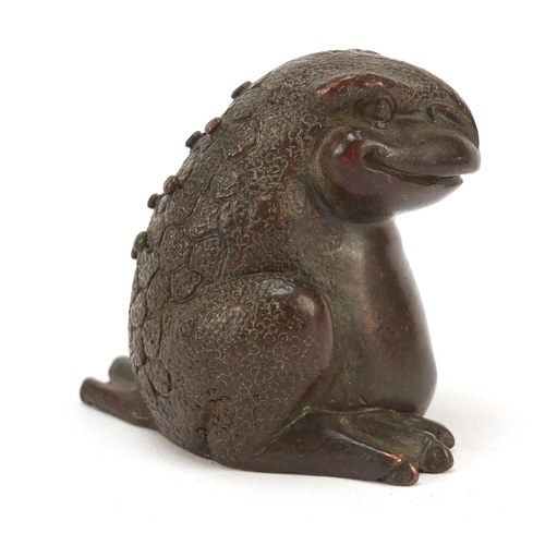 718 - Japanese patinated bronze seated armadillo, impressed marks to the base, 5cm high