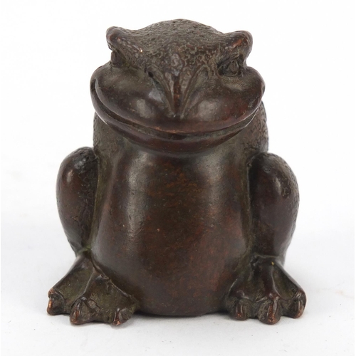 718 - Japanese patinated bronze seated armadillo, impressed marks to the base, 5cm high