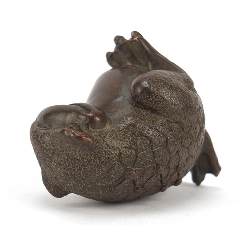 718 - Japanese patinated bronze seated armadillo, impressed marks to the base, 5cm high