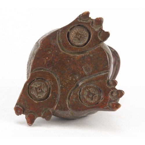 718 - Japanese patinated bronze seated armadillo, impressed marks to the base, 5cm high