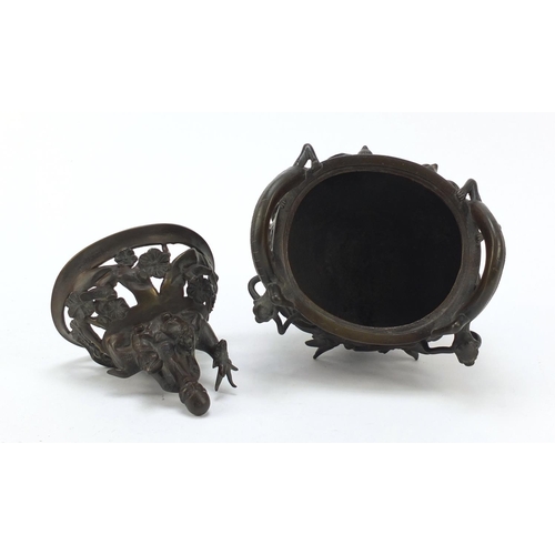 224 - Chinese patinated bronze tripod censer with figural cover, 27cm high