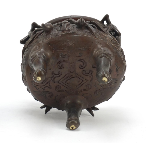 224 - Chinese patinated bronze tripod censer with figural cover, 27cm high