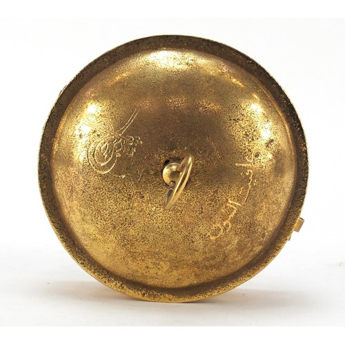 611 - Turkish Tombak sweet box with sectional interior, engraved with calligraphy, 16cm in diameter