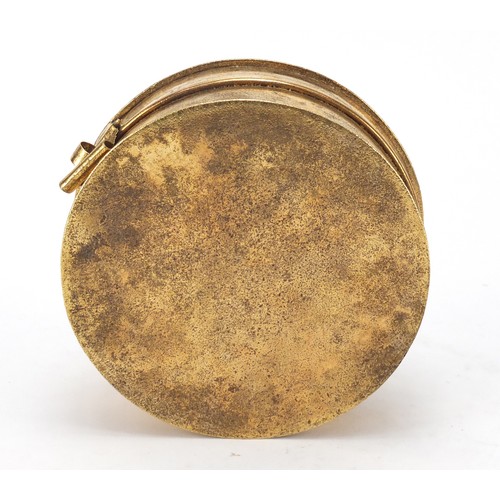 611 - Turkish Tombak sweet box with sectional interior, engraved with calligraphy, 16cm in diameter