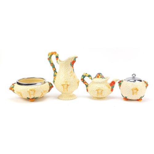 480 - Clarice Cliff Newport pottery including a teapot and jug, the largest 25.5cm high