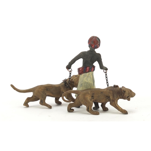 325 - Cold painted bronze of an Arab with two tigers in the style of Franz Xaver Bergmann, 13cm high