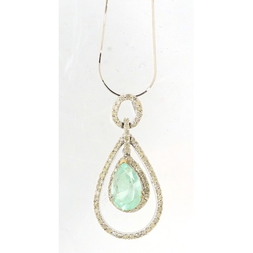 12 - 18ct white gold Columbian emerald and diamond surround pendant, 4cm in length on an 18ct white gold ... 