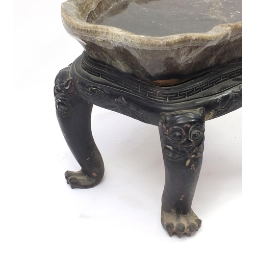 1309 - Large Chinese carved rock crystal tea table on hardwood base, carved with mythical creatures and flo... 