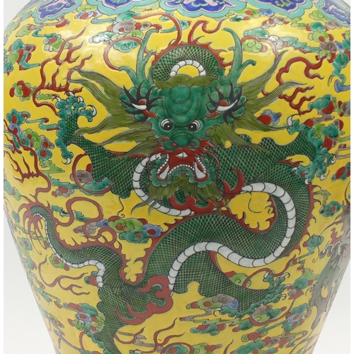 217 - Floor standing Chinese porcelain baluster vase and cover, hand painted with dragons amongst clouds a... 