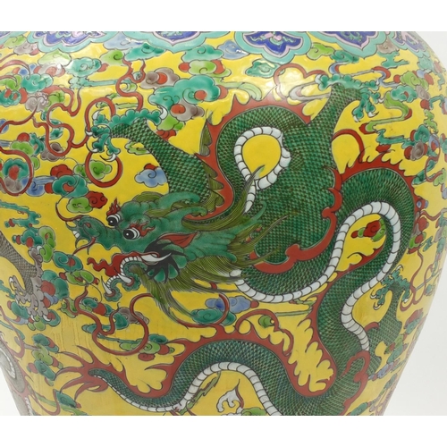 217 - Floor standing Chinese porcelain baluster vase and cover, hand painted with dragons amongst clouds a... 