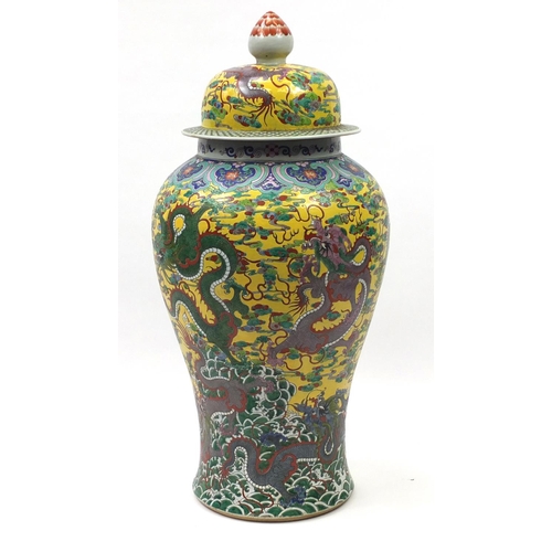 217 - Floor standing Chinese porcelain baluster vase and cover, hand painted with dragons amongst clouds a... 