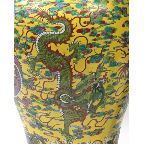 217 - Floor standing Chinese porcelain baluster vase and cover, hand painted with dragons amongst clouds a... 