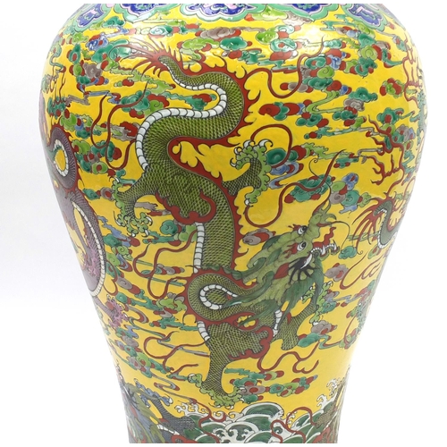 218 - Floor standing Chinese porcelain baluster vase and cover, hand painted with dragons amongst clouds a... 