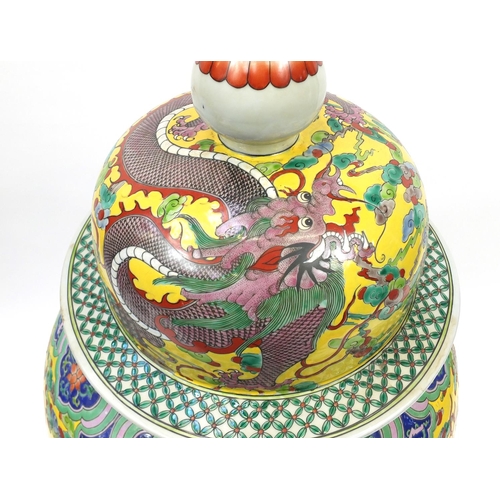 218 - Floor standing Chinese porcelain baluster vase and cover, hand painted with dragons amongst clouds a... 