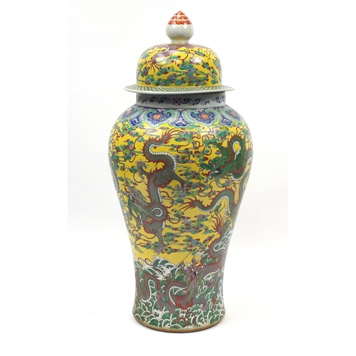 218 - Floor standing Chinese porcelain baluster vase and cover, hand painted with dragons amongst clouds a... 