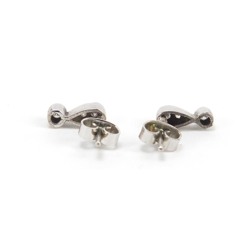 639 - Pair of 18ct white gold diamond stud earrings, 8mm in length, 1.4g