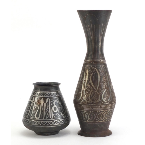 3786 - Two Indian Bidri ware vases decorated with calligraphy and foliate motifs, the largest 32cm high