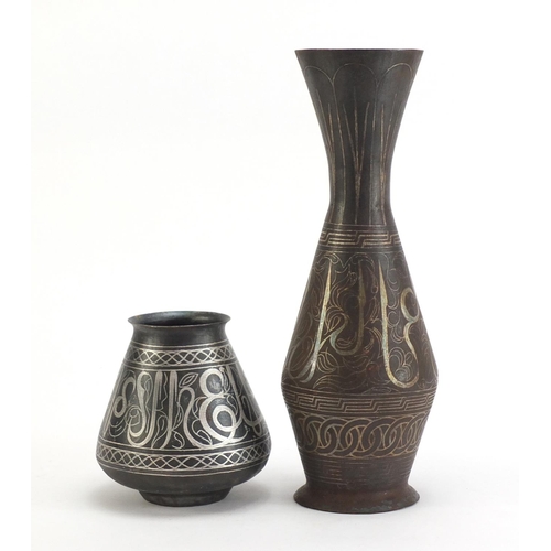 3786 - Two Indian Bidri ware vases decorated with calligraphy and foliate motifs, the largest 32cm high