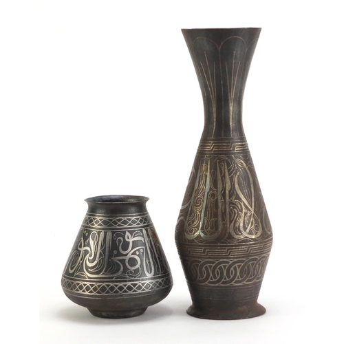 3786 - Two Indian Bidri ware vases decorated with calligraphy and foliate motifs, the largest 32cm high