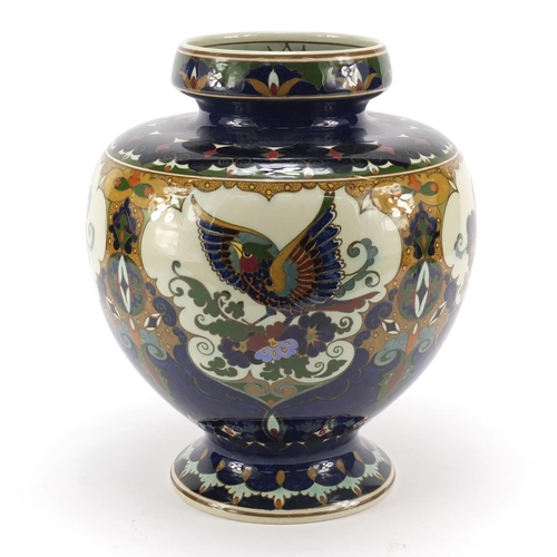 61 - Rozenburg, Dutch Art Nouveau vase hand painted with panels of stylised birds and flowers, numbered 4... 