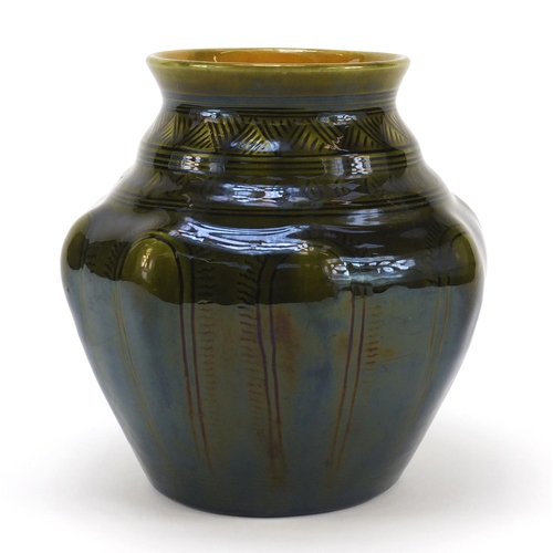 56 - Christopher Dresser for Linthorpe Pottery, Arts & Crafts pottery vase having a green glaze and incis... 