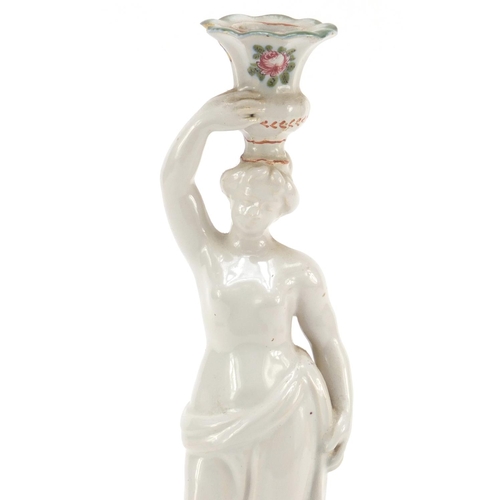 482 - 19th century French faience glazed figural candlestick in the form of a scantily dressed female, dec... 