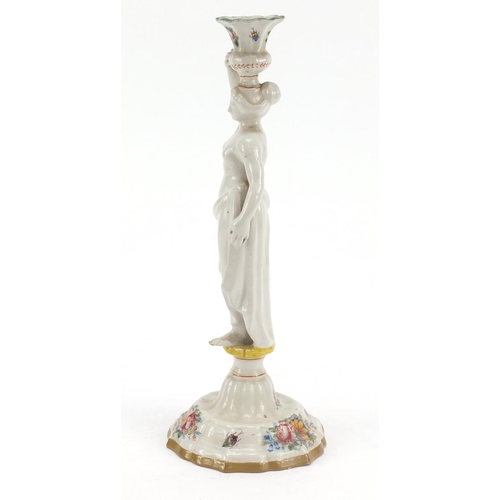 482 - 19th century French faience glazed figural candlestick in the form of a scantily dressed female, dec... 