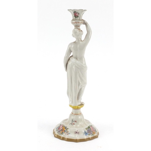 482 - 19th century French faience glazed figural candlestick in the form of a scantily dressed female, dec... 