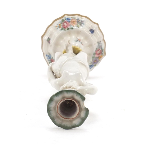 482 - 19th century French faience glazed figural candlestick in the form of a scantily dressed female, dec... 